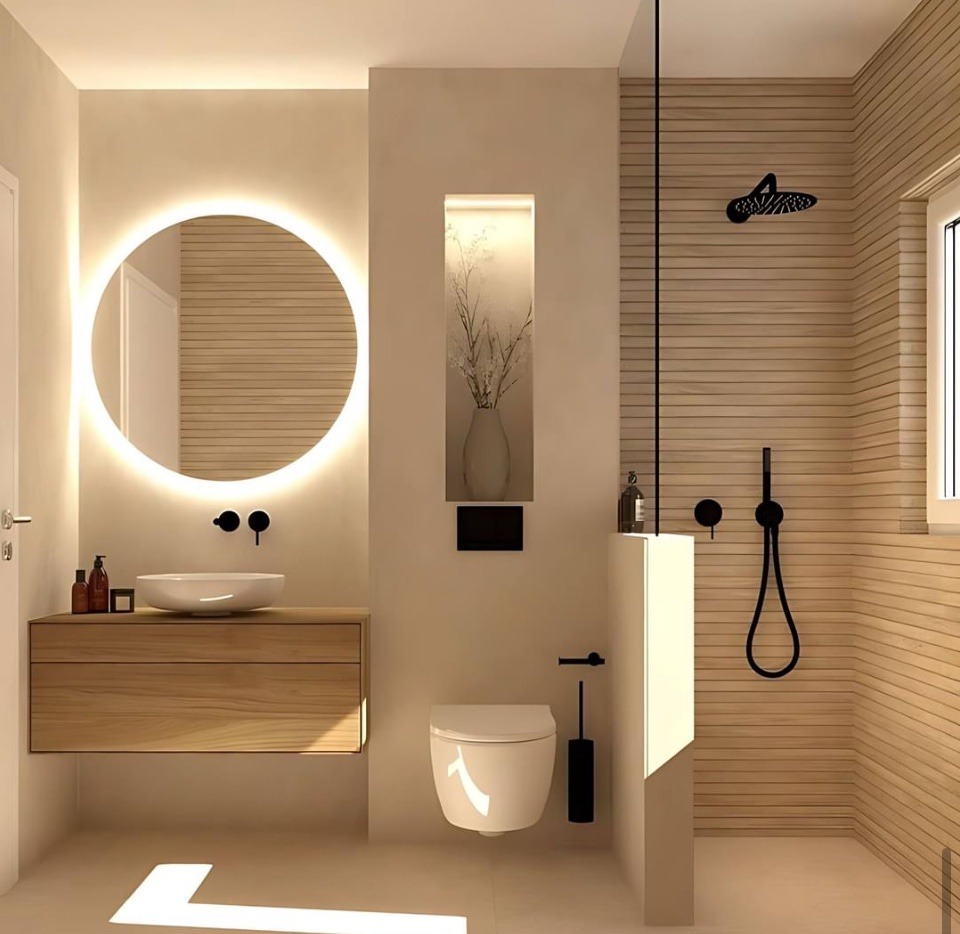 Modern bathroom with wall-hung vanity, round backlit mirror and walk-in shower